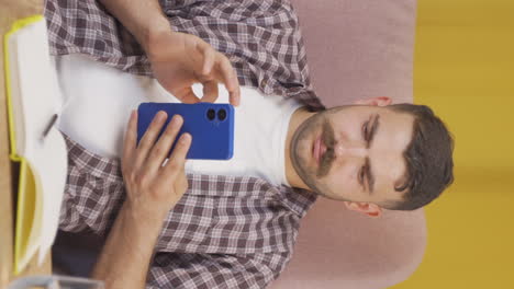 Vertical-video-of-The-man-on-the-phone.